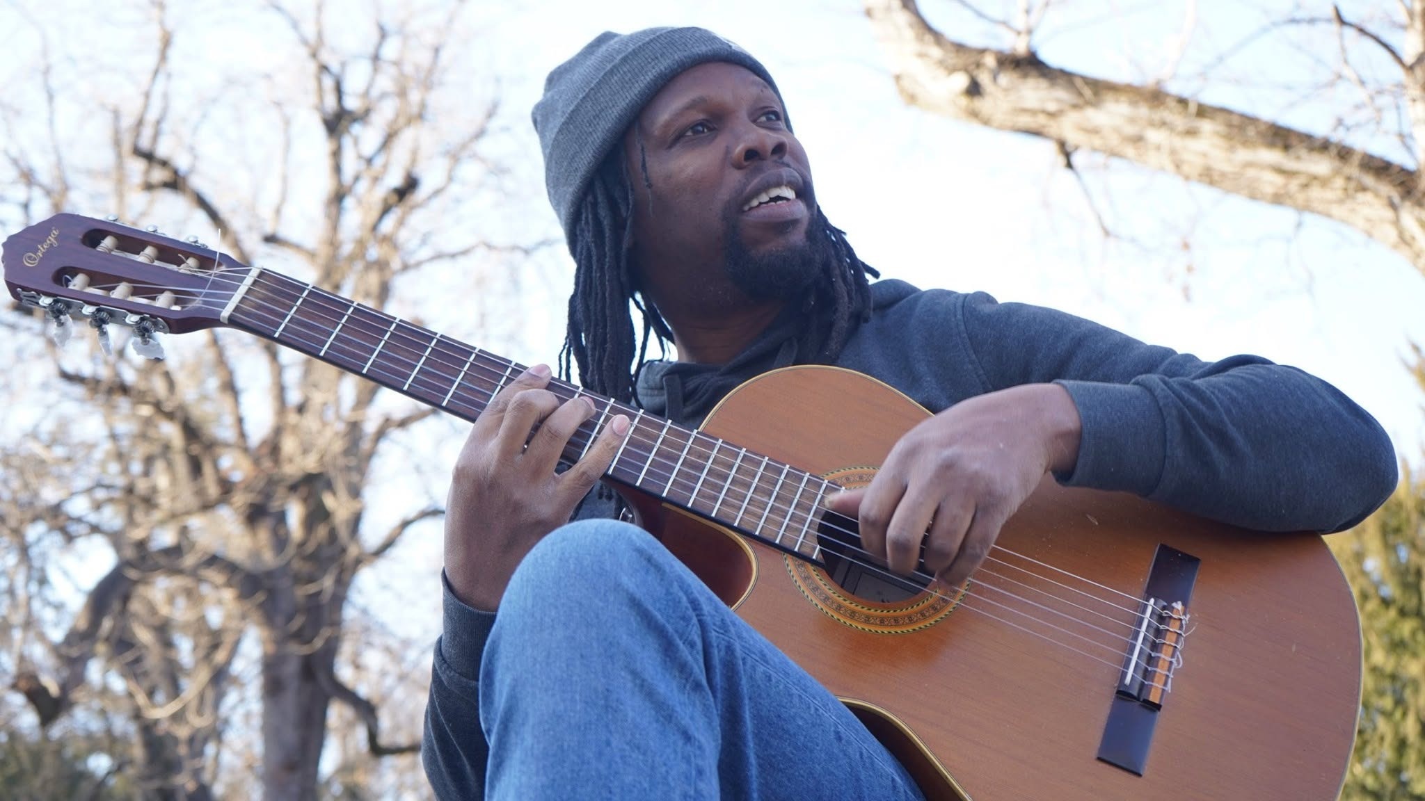 Lee Holness with nylon string guitar